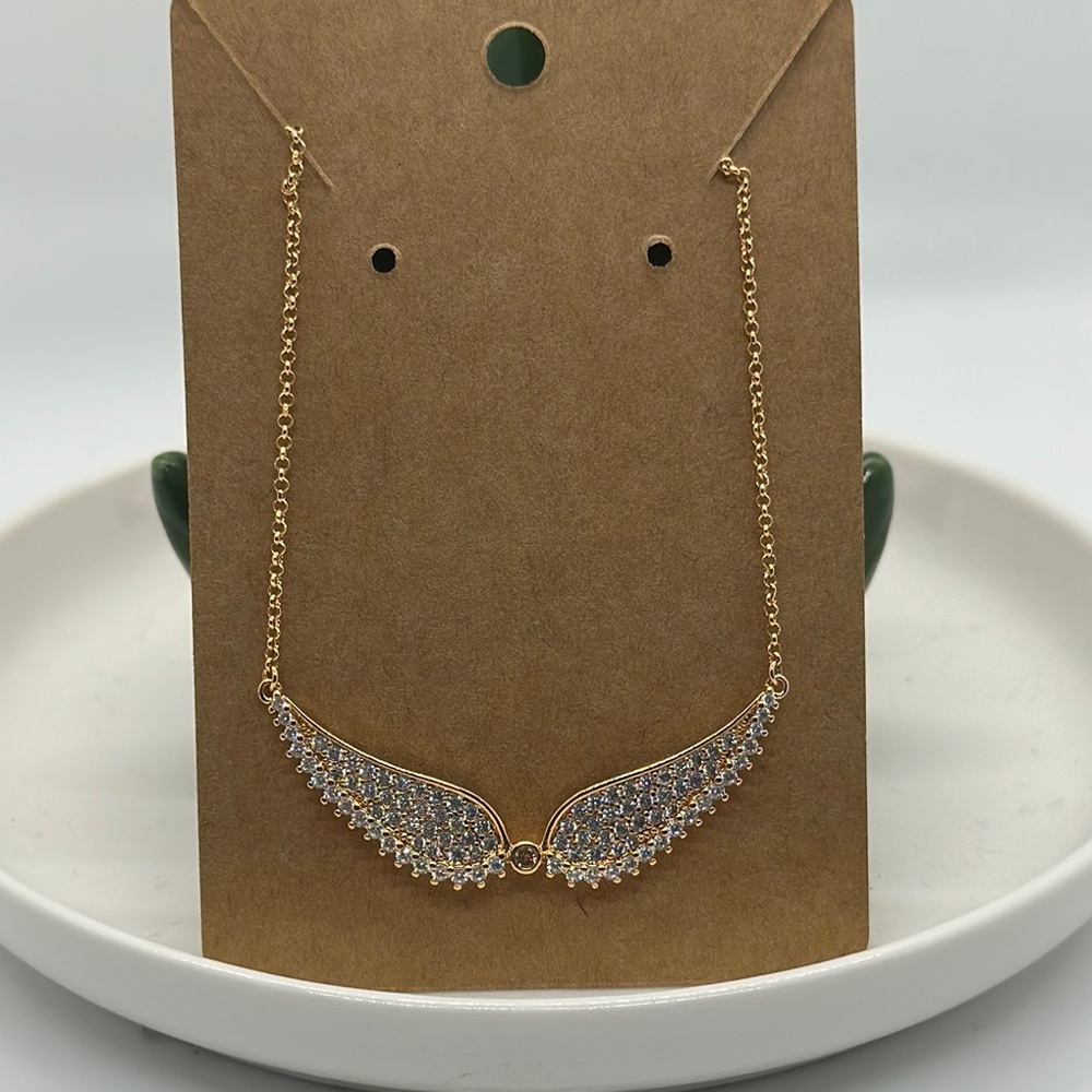 Elegant Rose Gold and Silver Wing Necklace never worn no bag no tag.
